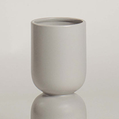 Closeup of light grey ceramic vase featuring its smooth matte finish and sculptural double form ideal for stylish minimal decor.