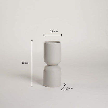 Light grey ceramic vase with sculptural shape and 16 cm height and 14 cm width shown clearly for accurate decor size reference.