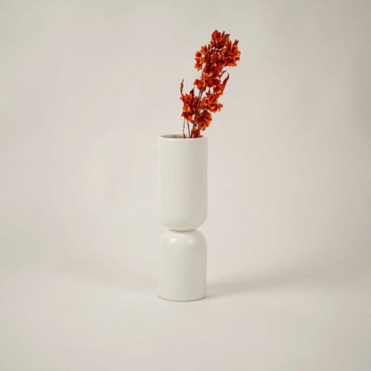 Minimal white ceramic vase displayed on a clean white background offering a modern sculptural decor look.