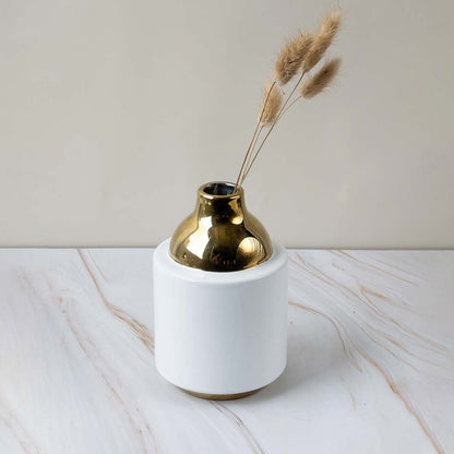 Elegant ceramic vase with glossy white body and golden neck perfect for modern living room tabletop decor.