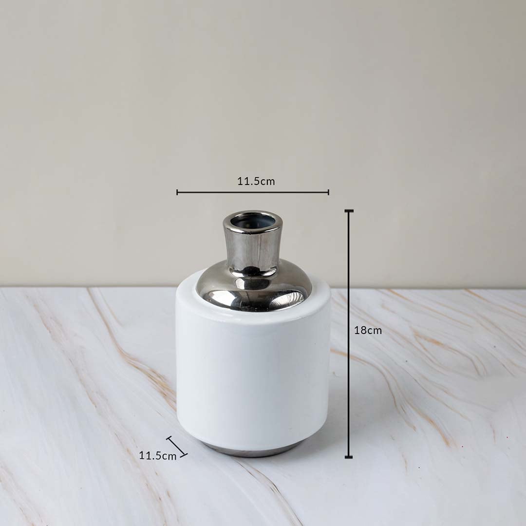 Modern ceramic vase with silver accent shown with height and diameter measurements for better size reference.
