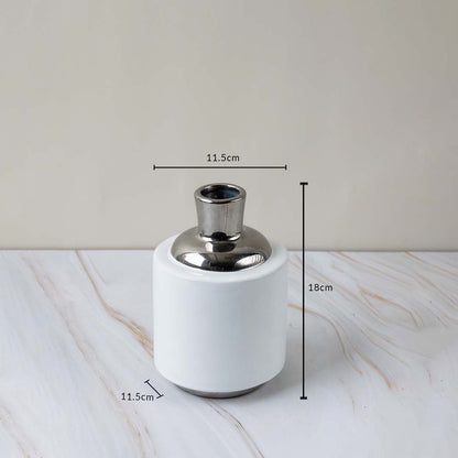 Modern ceramic vase with silver accent shown with height and diameter measurements for better size reference.