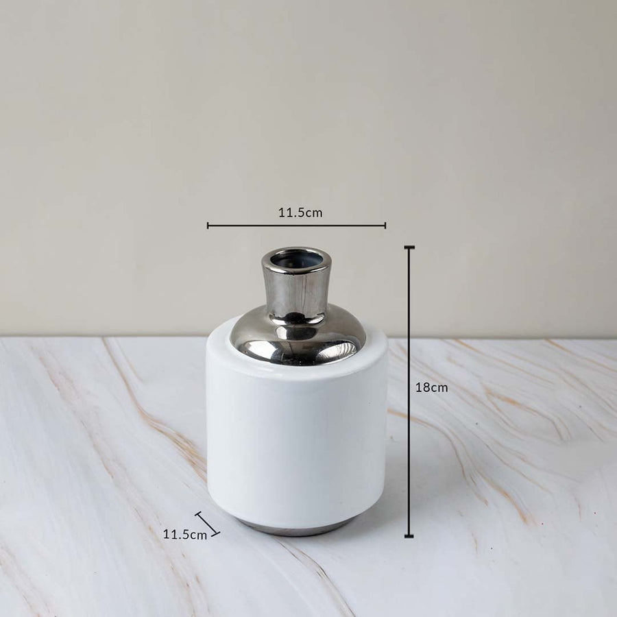 Modern ceramic vase with silver accent shown with height and diameter measurements for better size reference.