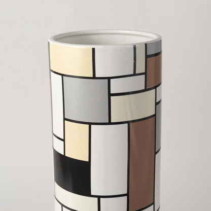 Closeup view of the white ceramic sculptural vase showing its smooth flowing curves and artistic handcrafted modern design.