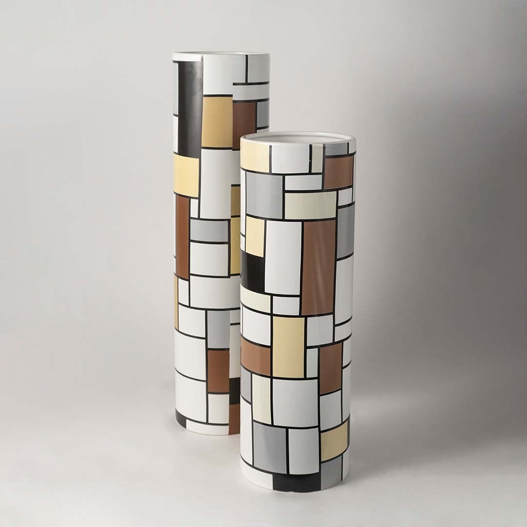 Artistic white sculptural ceramic vase displayed as part of a curated decor setup adding contemporary elegance to interiors.