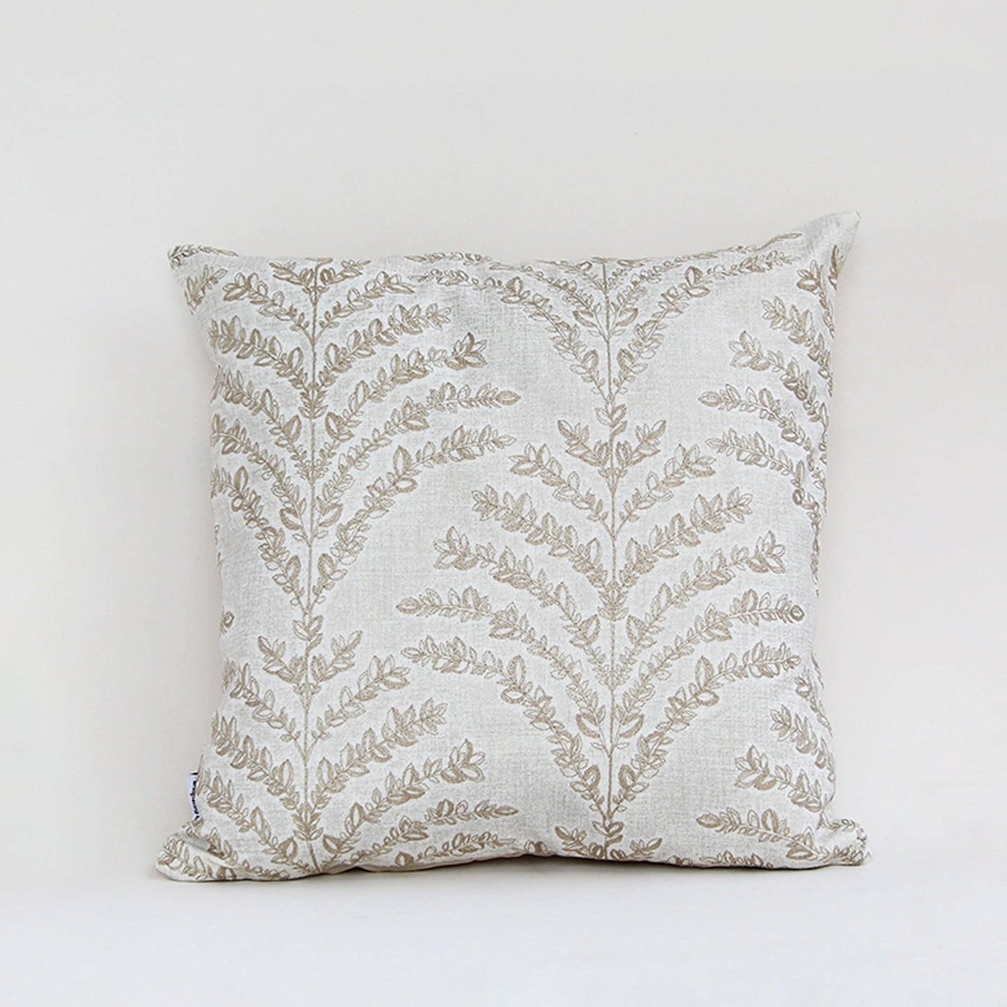 White cotton cushion cover with beige botanical leaf print for sofa bedroom seating and elegant home decor styling.