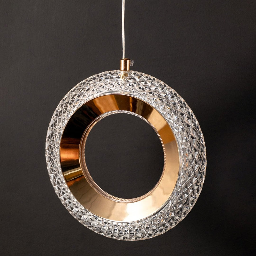 Detailed closeup of gold crystal pendant light frame showing luxury finish for home and office interiors.