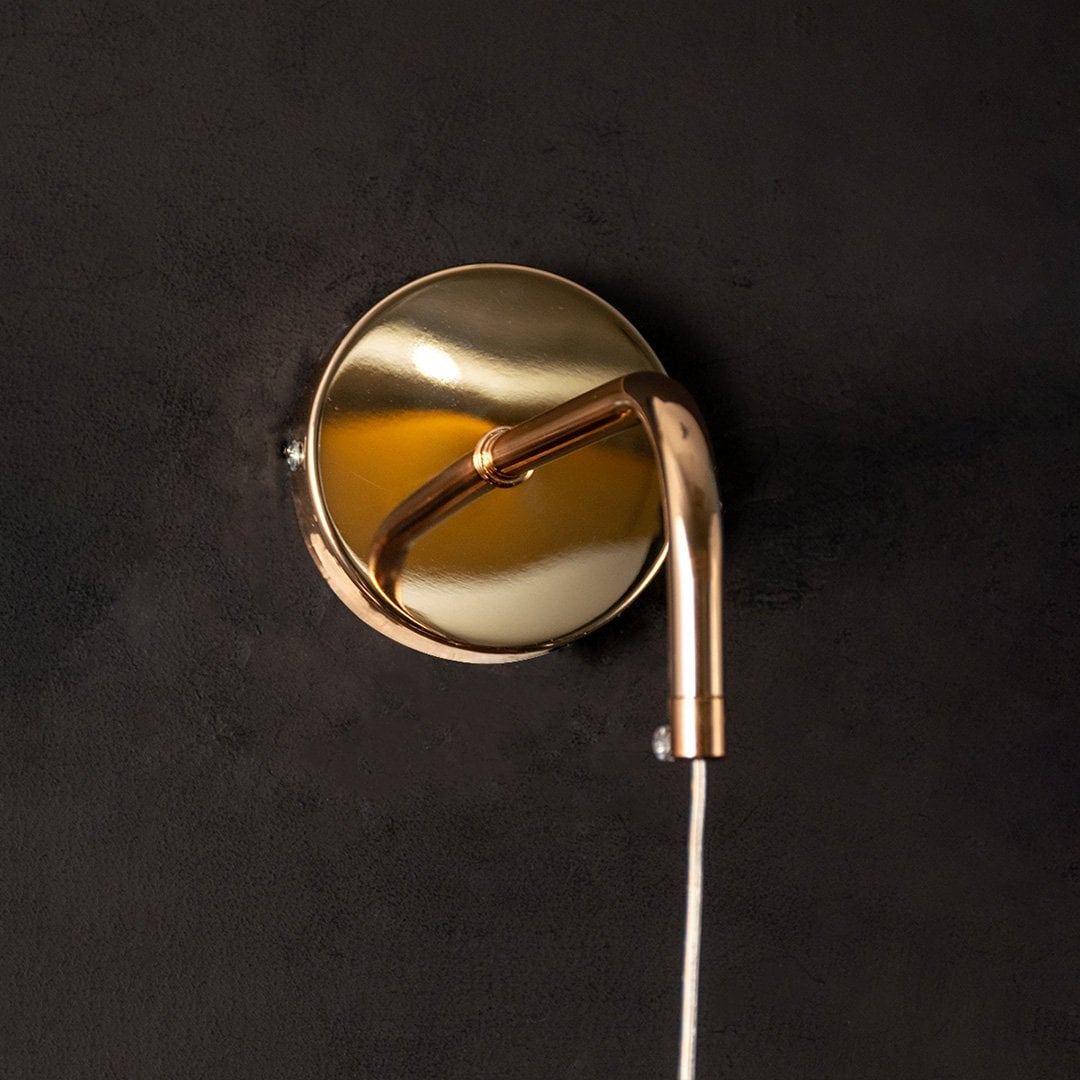 Closeup of round gold and crystal pendant light highlighting detailed ring design for modern ceiling decor.