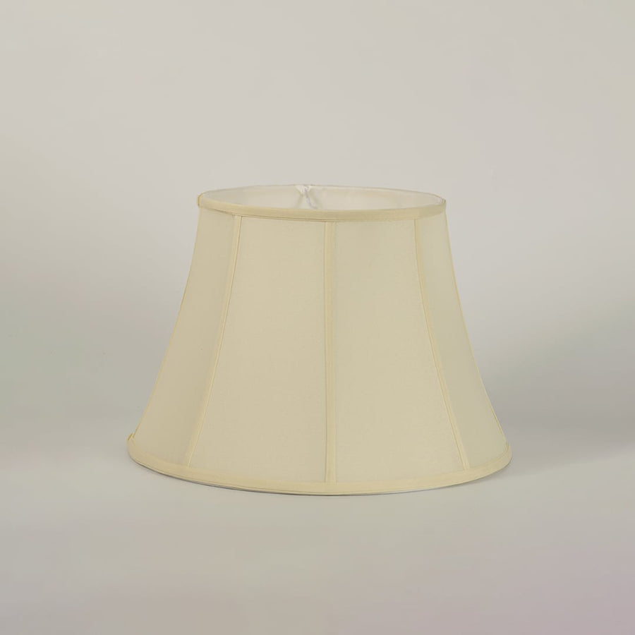Soft cream fabric lampshade part of table lamp creating a cozy and inviting glow that enhances the ambience of modern and classic interiors.