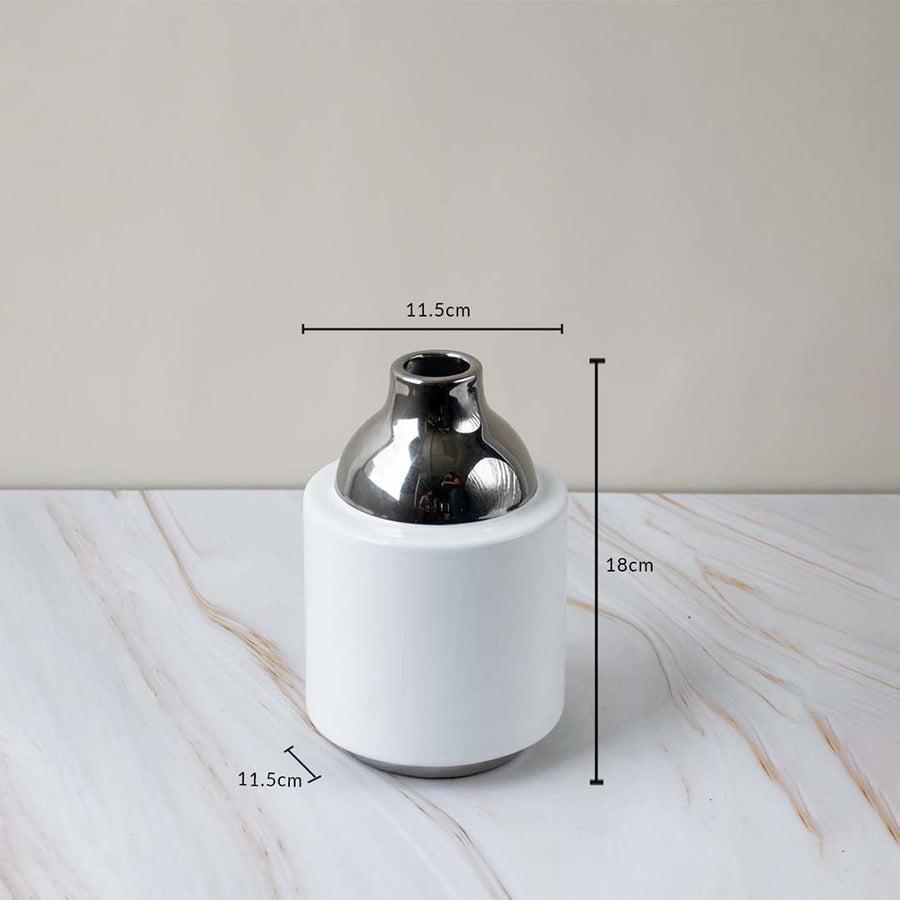 Ceramic vase with glossy white body silver neck size 18cm height 11.5cm width perfect for tabletop and home decoration.