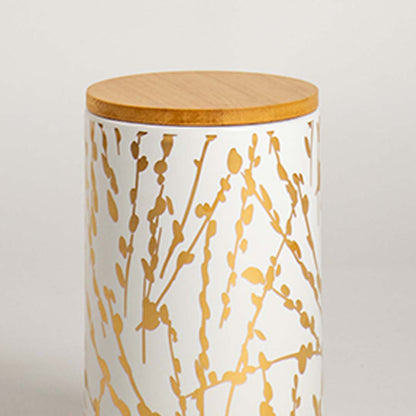 Closeup view of a ceramic jar with a golden botanical design and smooth wooden lid  showcasing its texture  detailing  and clean finish.