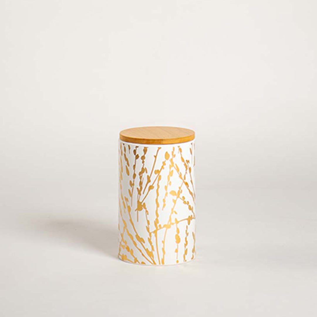 Elegant ceramic jar with golden botanical artwork and wooden lid presented on a soft white background for a simple and modern product view.