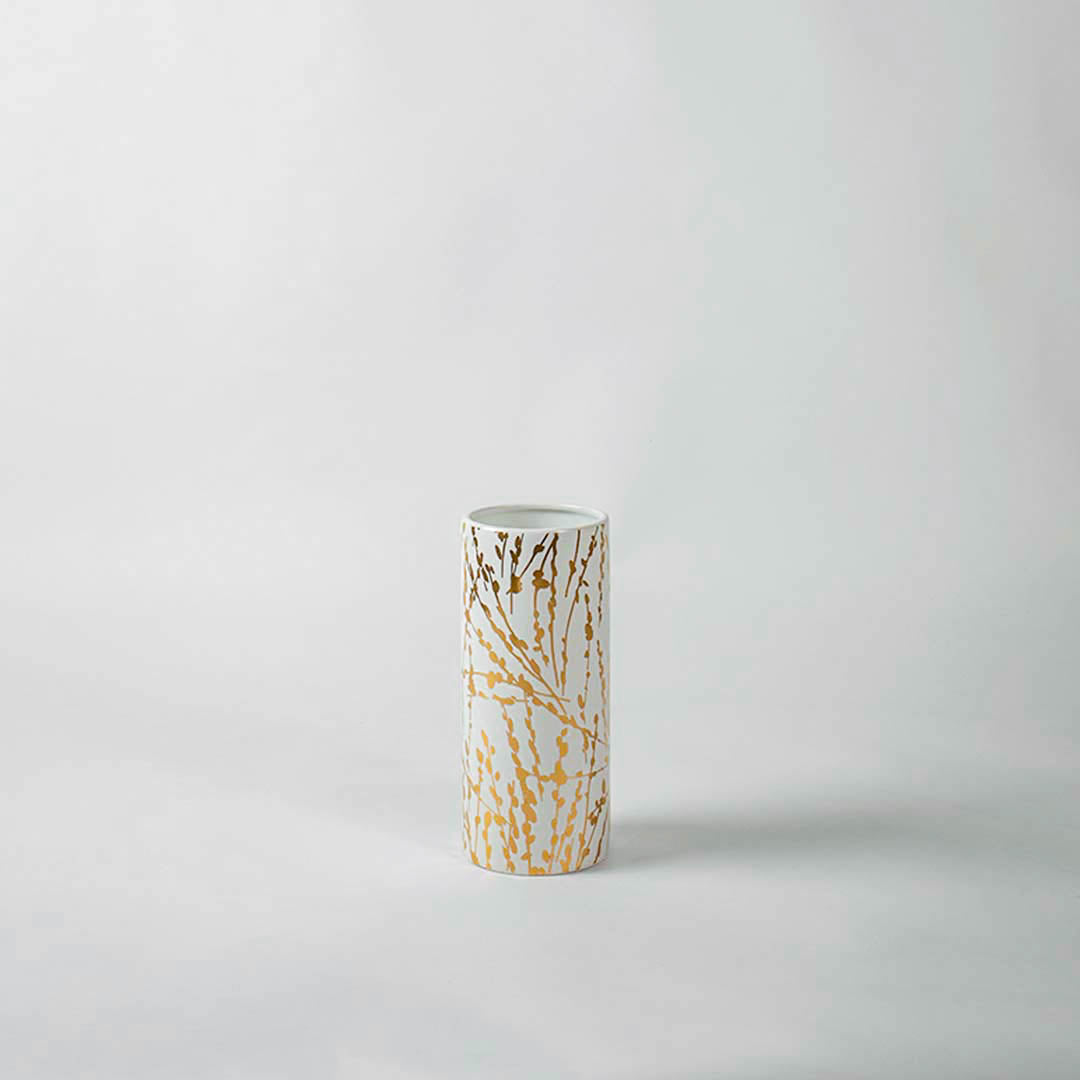 White ceramic decorative vase with gold abstract detailing for tabletop styling and elegant modern home decor.