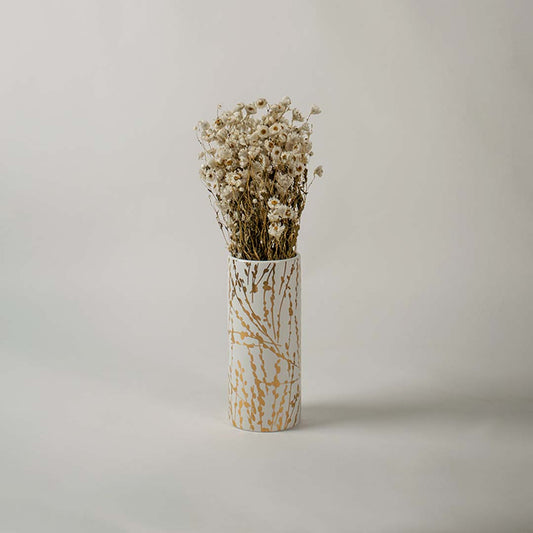 White ceramic decorative vase with gold abstract detailing styled with dried flowers for elegant modern home decor.