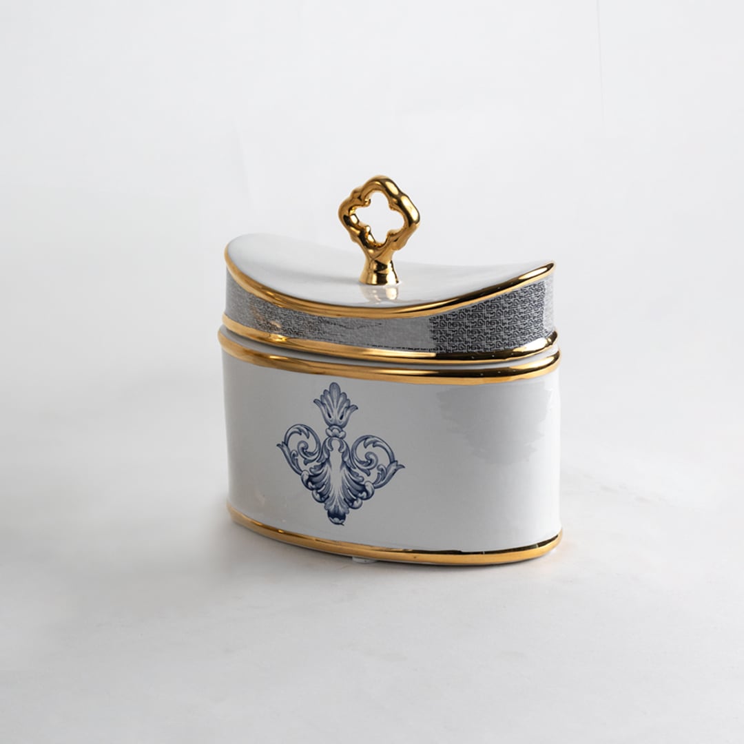 White ceramic jar with blue and gold artwork in a front view perfect for refined décor styling and elegant console placement.