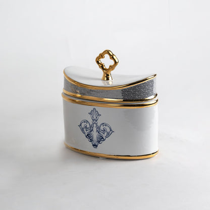 White ceramic jar with blue and gold artwork in a front view perfect for refined décor styling and elegant console placement.