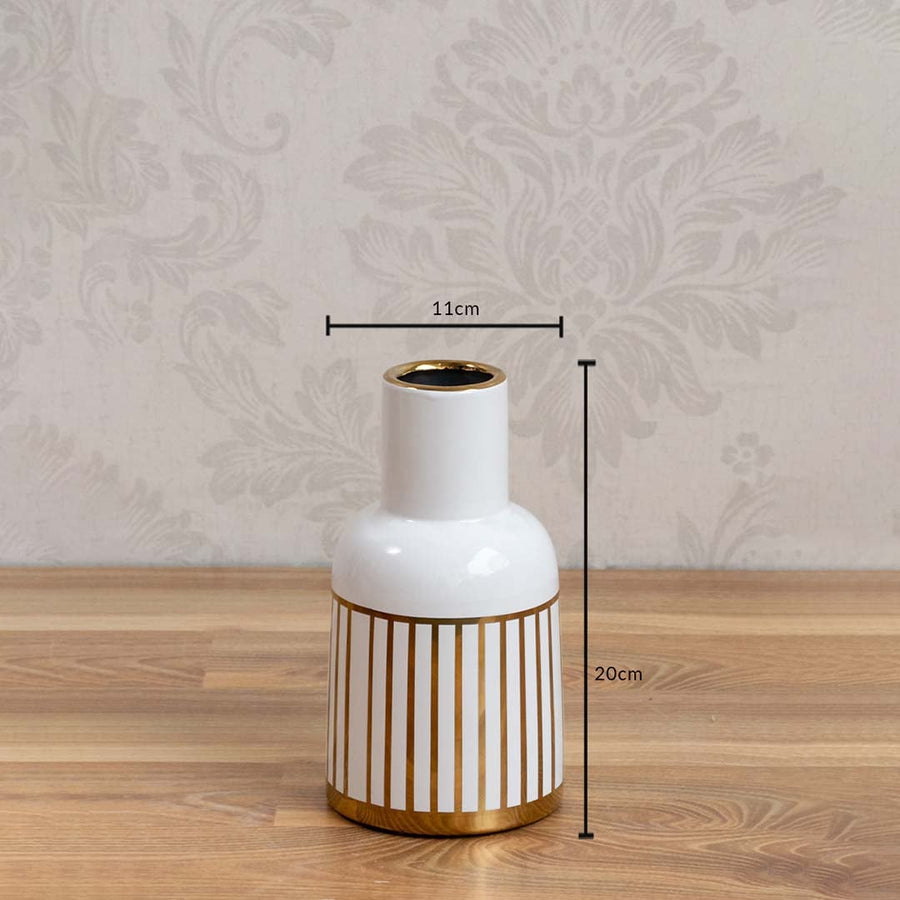 A white ceramic vase with gold stripes shown with measurements of 20 cm height and 11 cm width clearly presenting its compact decorative size.