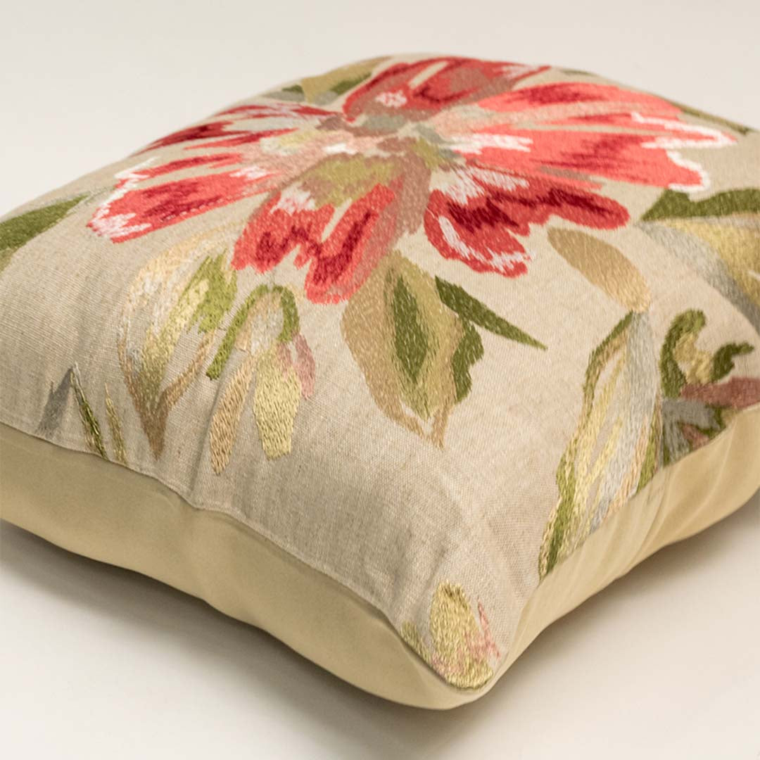 White cotton cushion cover with red floral print showcasing soft cotton fabric texture and premium stitched craftsmanship.