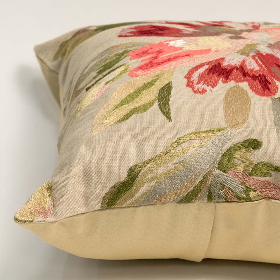 Closeup image highlights detailed stitching and soft beige fabric with red flower design ideal for living room sofa cushion styling.