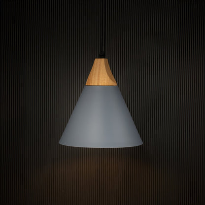 Modern grey pendant light with wood accent illuminated on back background for elegant dining or cafe ceiling decor.