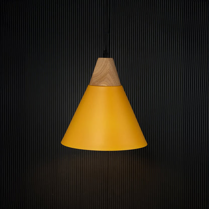 Yellow pendant ceiling light with wood detail illuminated on back background for cafe dining and home interior lighting.