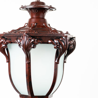 Closeup of brown metal hanging lantern showcasing ornate detailing and frosted glass for a premium vintage look.