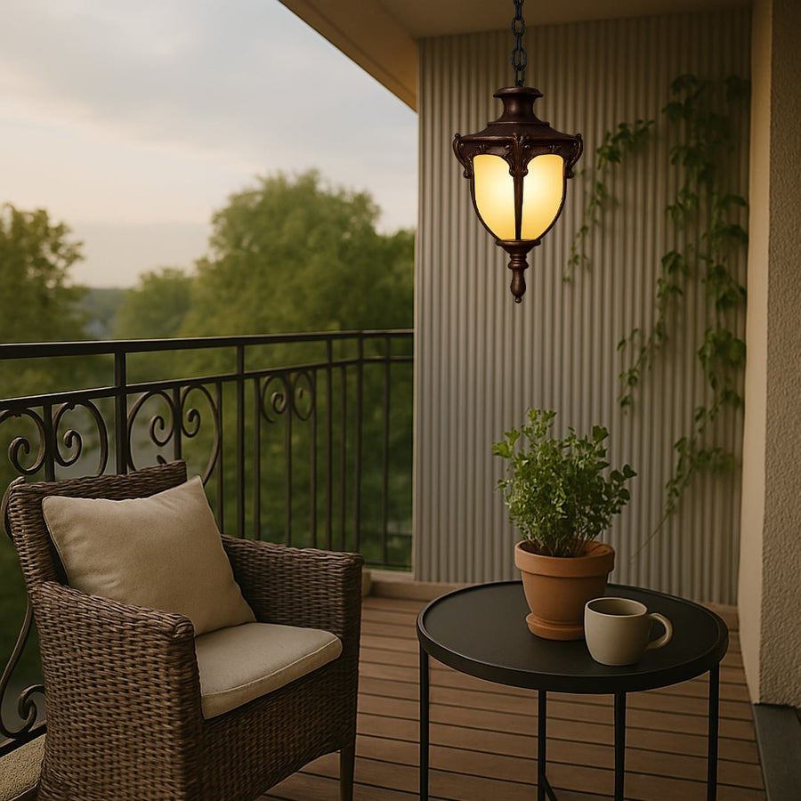 Vintage hanging outdoor light with frosted glass and brown metal frame adding elegant charm to garden and porch decor.