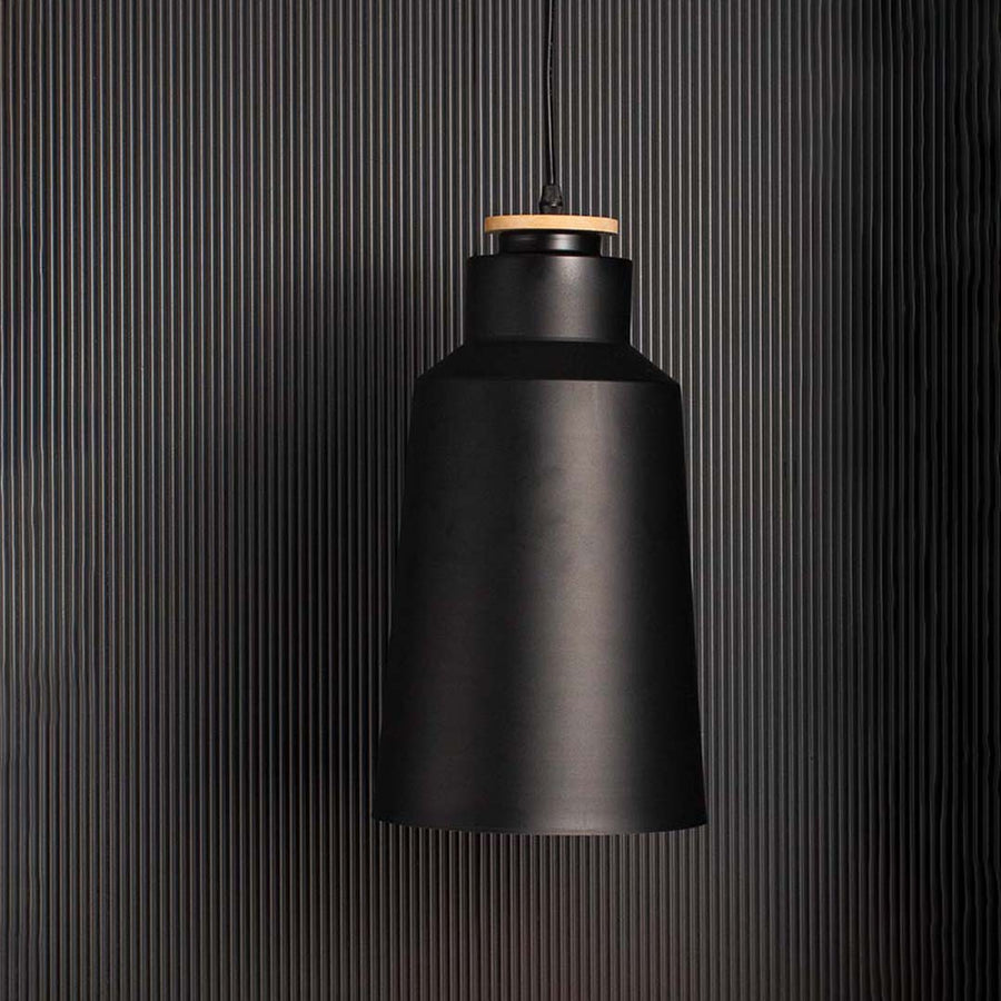 Stylish matte black pendant ceiling lamp with wooden top shown on soft dark background setting.