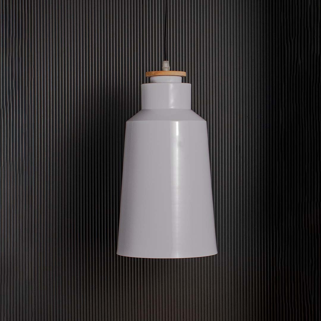 Modern white conical pendant lamp with tall metal shade and wooden accent displayed off on black background decor.