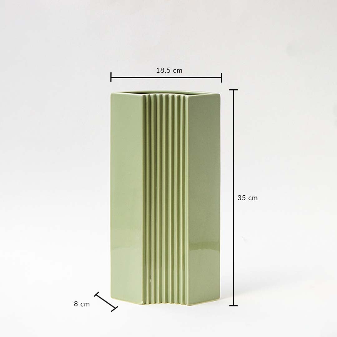 Green modern vase shown with dimensions 35 cm height 18.5 cm width and 8 cm depth highlighting its tall slim structure and ribbed detailing for accurate size reference.