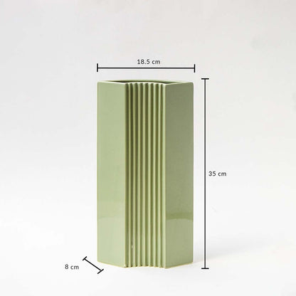 Green modern vase shown with dimensions 35 cm height 18.5 cm width and 8 cm depth highlighting its tall slim structure and ribbed detailing for accurate size reference.