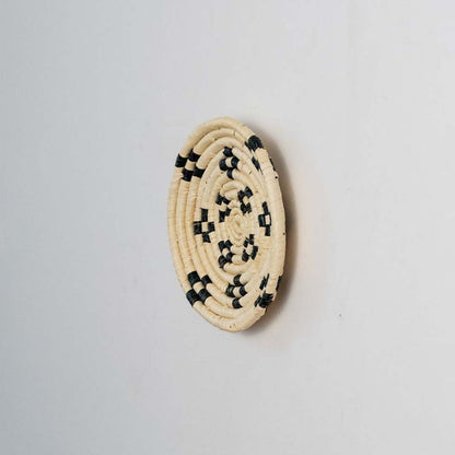 Side view of woven basket wall decor showing raised weaving details handmade texture and depth of craftsmanship.