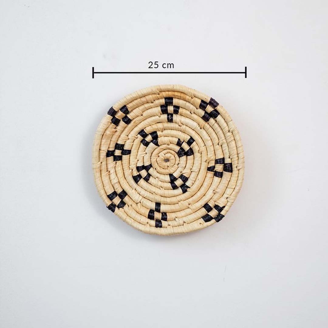 Small round woven wall basket with intricate black detailing showing 20 cm diameter designed for compact wall decor arrangements.