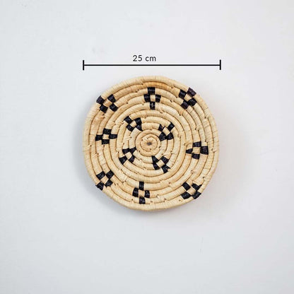 Small round woven wall basket with intricate black detailing showing 20 cm diameter designed for compact wall decor arrangements.