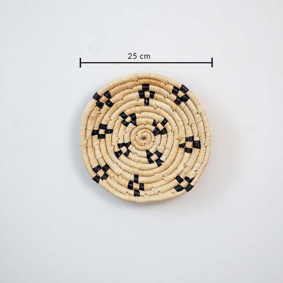 Small round woven wall basket with intricate black detailing showing 20 cm diameter designed for compact wall decor arrangements.