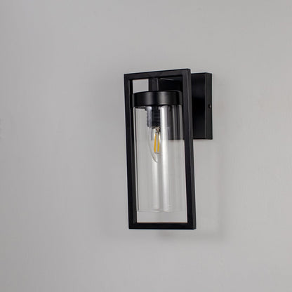 Modern rectangular wall light with matte black metal frame and clear glass shade shown off on white background for decor.