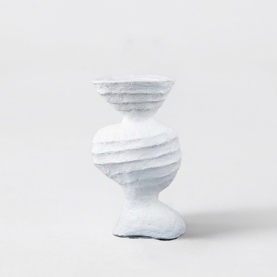 Sculptural white ceramic vase with artistic textured design modern decorative accent for table and shelf decor.