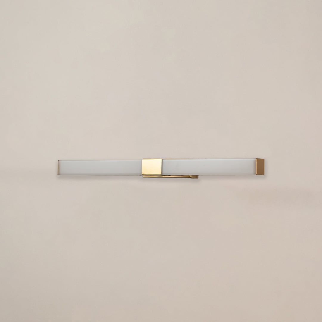 White and gold picture light with light off on white background perfect for art walls living rooms and contemporary home decor.