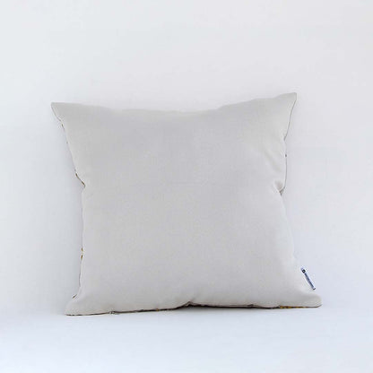 Backside of the cushion cover in a beige cotton fabric offering a smooth minimal décor style with a breathable soft and skin friendly material for daily comfort.