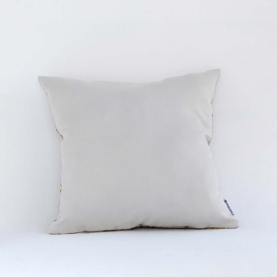 Backside of the cushion cover in a beige cotton fabric offering a smooth minimal décor style with a breathable soft and skin friendly material for daily comfort.