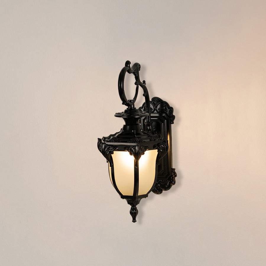 Vintage black outdoor lantern wall light on white background with decorative mount for classic patio decor.