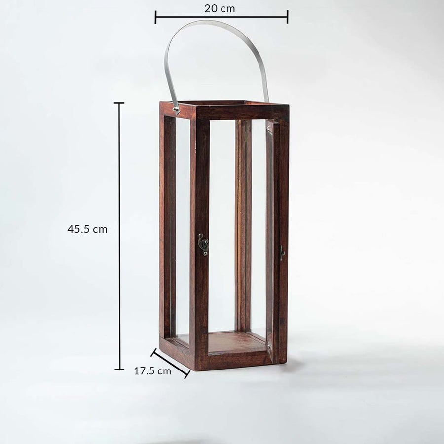 Wood and glass lantern with metal handle measuring 45.5 cm height 20 cm width and 17.5 cm depth on white background.