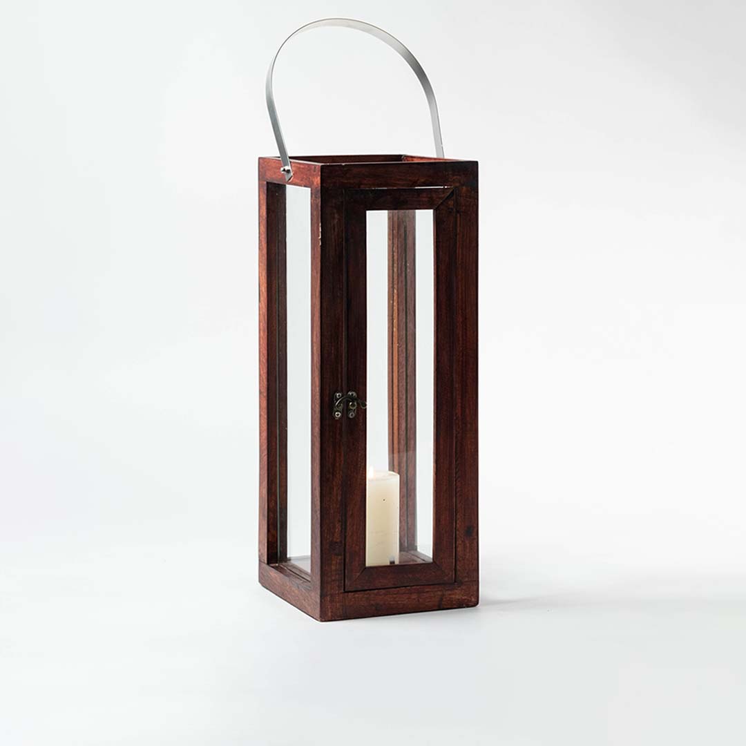 Elegant tall brown wooden lantern with transparent glass and silver handle perfect for indoor or outdoor lighting.
