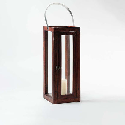 Elegant tall brown wooden lantern with transparent glass and silver handle perfect for indoor or outdoor lighting.