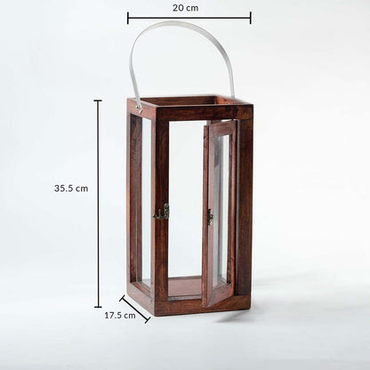 Wood and glass lantern with metal handle measuring 35.5 cm height 20 cm width and 17.5 cm depth on white background.