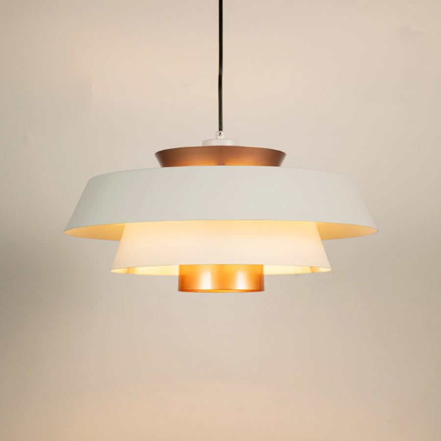 White and copper metal pendant light glowing warmly on white background creating stylish ambience for home office cafe and more spaces.
