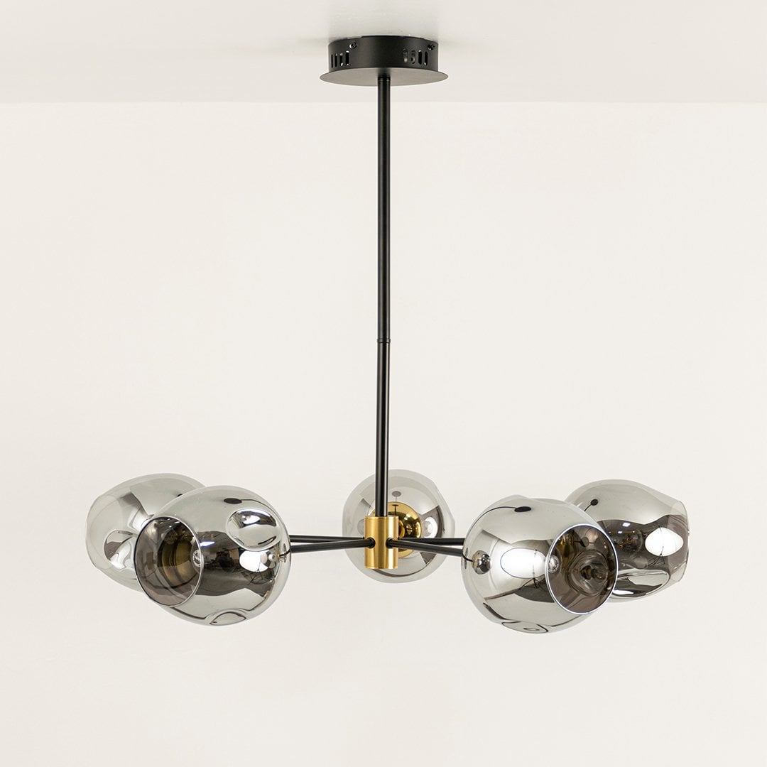 Smoked chrome glass chandelier displayed on white background with light off showing sleek design gold joints and artistic modern structure.
