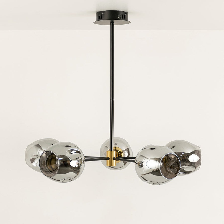 Smoked chrome glass chandelier displayed on white background with light off showing sleek design gold joints and artistic modern structure.