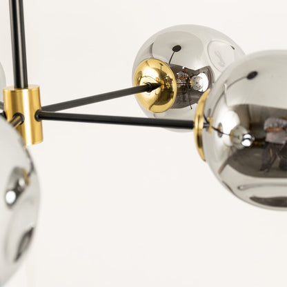 Close view of smoked chrome glass chandelier showing metallic finish glass texture and premium detailing of elegant handcrafted design.