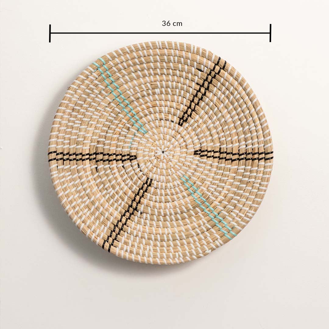 Woven wall basket measuring 36 cm in diameter with turquoise and black linear detailing and symmetrical hand-woven texture.